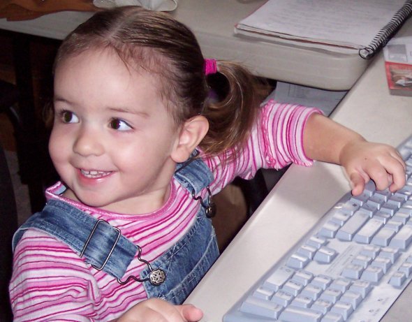 "I'm 'working' on Mommy's computer." (September 22)