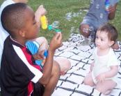 Dionne is blowing bubbles for me.