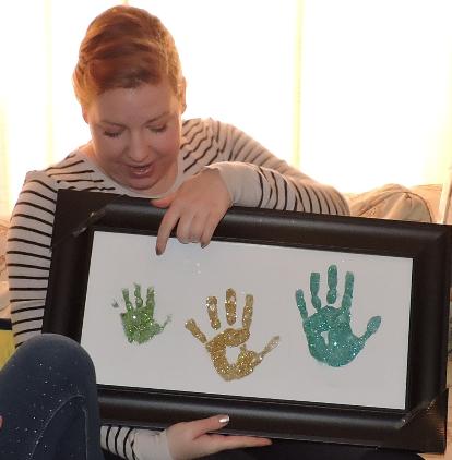 Oren's, Chloe's, and Julianna's hand prints.