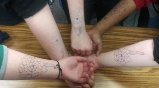 Tayler drew flowers on our arms. (March 15, 2018)