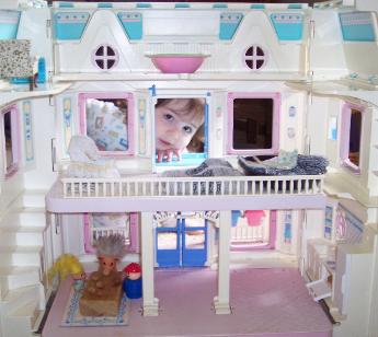 Playing with my doll house from Aunt Mary.