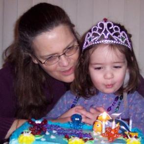 Helping Mommy blow out her birthday candles.