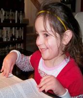 Reading one of Daddy's books.