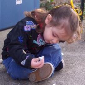 Drawing with chalk on the back porch.