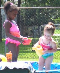 Playing in my pool with my neighbor, Erin.